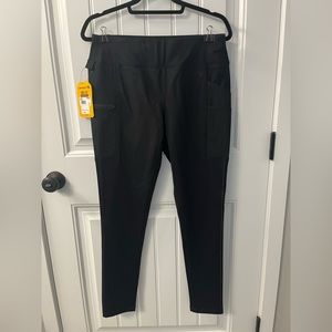 Women’s Carhartt fitted black pants.  Never worn, brand new.  Size medium.